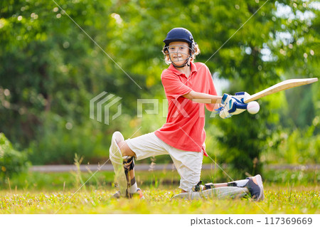 Kids playing cricket in summer park Kids playing cricket in summer park 117369669