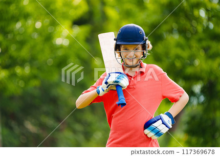 Kids playing cricket in summer park 117369678