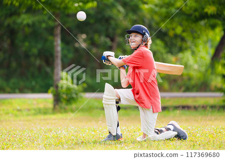 Kids playing cricket in summer park Kids playing cricket in summer park 117369680