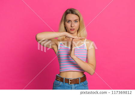 Tired upset woman showing pause gesture, limit or stop sign, time out, take a break relax, rest 117369812