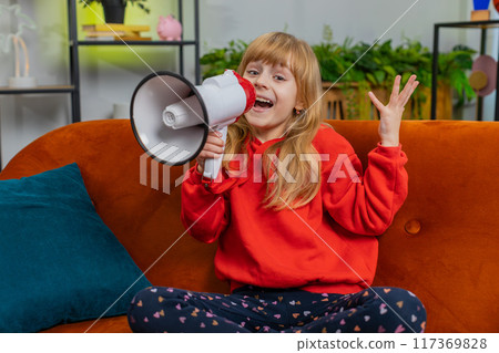 Preteen child girl kid talking with megaphone, proclaiming news, loudly announcing advertisement Preteen child girl kid talking with megaphone, proclaiming news, loudly announcing advertisement 117369828
