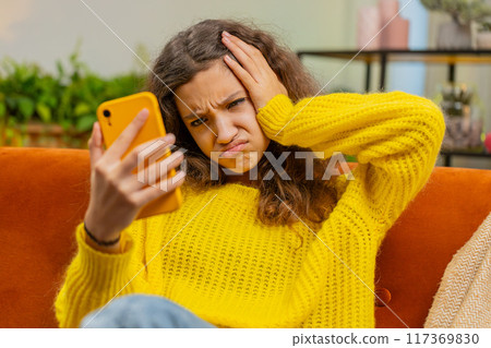 Child kid girl use smartphone, playing game loses surprised lottery result fail education study test Child kid girl use smartphone, playing game loses surprised lottery result fail education study test 117369830