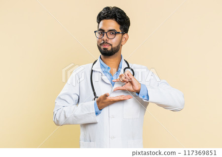 Doctor man show a little bit gesture begging help need some more please give me measuring small size 117369851