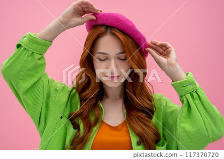 Pretty young confident woman in pink beret and bright clothes Pretty young confident woman in pink beret and bright clothes 117370720