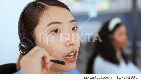 Call center, technical support and woman consultant in office for online consultation with headset. Crm, contact and professional Asian female telemarketing or sales agent working on customer service 117372933