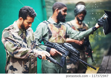 Military men, paintball gun and game, competition or sports challenge for battle, fight and survival. Soldier, army or warrior people shooting paint weapon in war training for battlefield protection 117372947