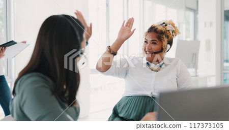 Business people, call center and high five in winning, teamwork or partnership in customer service at office. Women touching hands in celebration for team promotion, sale or success in contact us 117373105