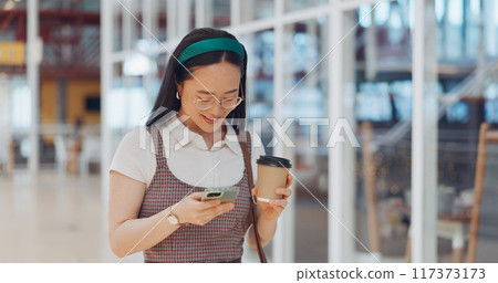 Phone, coffee and businesswoman in the airport networking on social media, mobile app or the internet. Technology, smile and young Asian female person scroll on website with cellphone in hotel lobby. Phone, coffee and businesswoman in the airport networking on social media, mobile app or the internet. Technology, smile and young Asian female person scroll on website with cellphone in hotel lobby. 117373173