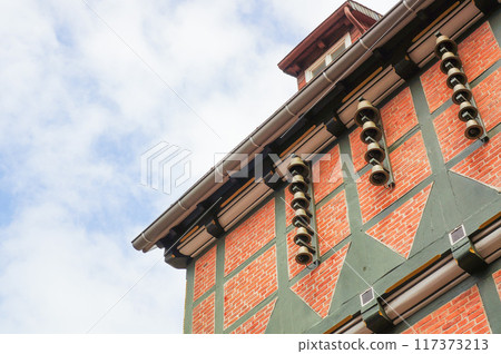 A wall lined with small bells A wall lined with small bells 117373213