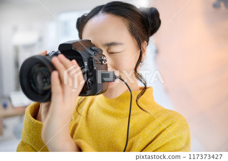 photography, camera and woman in studio shooting creative memory picture, photoshoot or digital production. Lens focus, art creativity and young Japanese photographer girl working for artistic shot 117373427