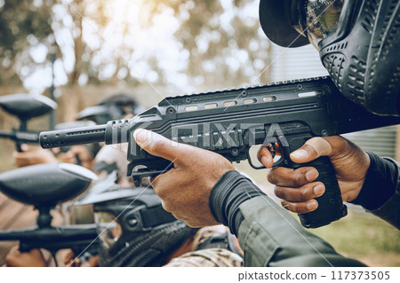 Paintball, gun and target with team, action and sports outdoor, people on battlefield and soldier focus during war game. Extreme sport, aim and military mission, exercise and fitness with motion blur 117373505