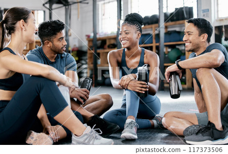 Fitness, conversation and friends at the gym for training, exercise motivation and relax after cardio. Laughing, happy and people with a group discussion about a workout, health class and performance 117373506