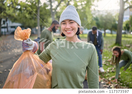 Park, plastic bag and woman in cleaning portrait for eco friendly environment, community service or volunteering. Recycle, trash or waste goals of happy ngo person in nature, forest pollution support Park, plastic bag and woman in cleaning portrait for eco friendly environment, community service or volunteering. Recycle, trash or waste goals of happy ngo person in nature, forest pollution support 117373597