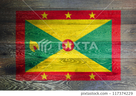 Grenada flag on rustic old wood surface background Grenada flag on rustic old wood surface background 117374229