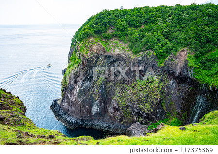The delicate Furepe Falls (Maiden's Tears) cascading down a cliff into the Sea of Okhotsk and a sightseeing boat ride to Shiretoko 117375369