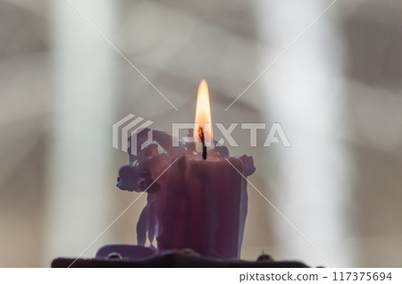 Burning candle in the church, close-up, selective focus Burning candle in the church, close-up, selective focus 117375694