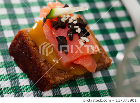 Canape with salmon and mango sauce 117375901