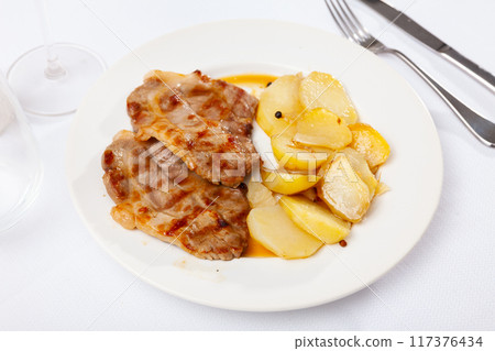 Appetising pork chop served with potato 117376434