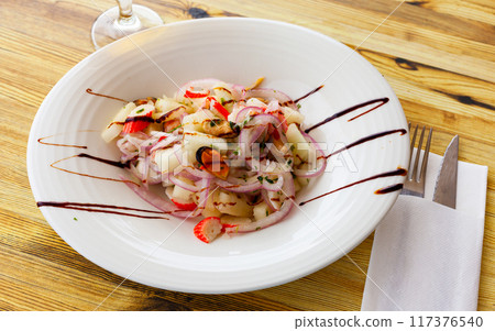 Salad with melon, mussels and crab sticks 117376540