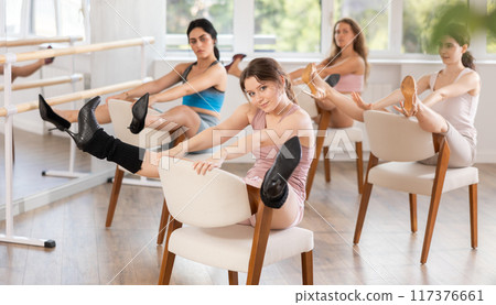 Sitting on chair, girl train to perform lap dance, interacting with imaginary partner Sitting on chair, girl train to perform lap dance, interacting with imaginary partner 117376661