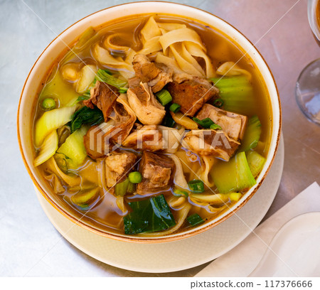 Bowl of ramen with wheat noodles, veal, mushrooms, chard Bowl of ramen with wheat noodles, veal, mushrooms, chard 117376666