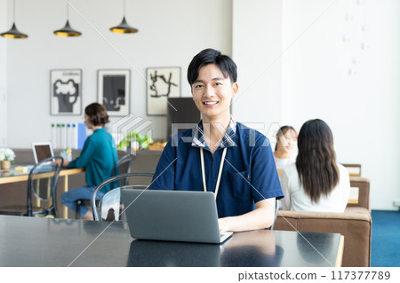 Young man working in the office 117377789