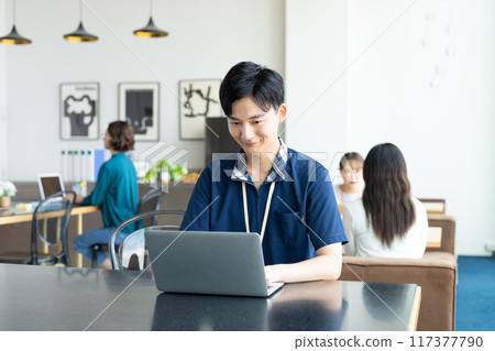 Young man working in the office 117377790