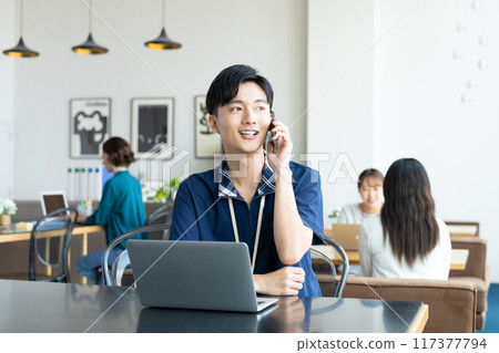 Young man working in the office Young man working in the office 117377794