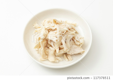 Boiled and split chicken breast on white background Boiled and split chicken breast on white background 117378511