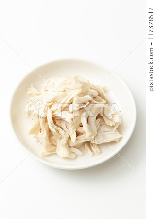 Boiled and split chicken breast on white background Boiled and split chicken breast on white background 117378512