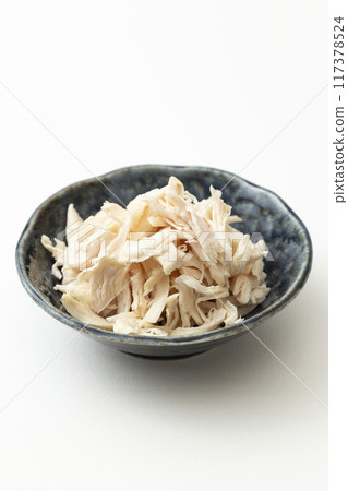 Boiled and split chicken breast on white background Boiled and split chicken breast on white background 117378524