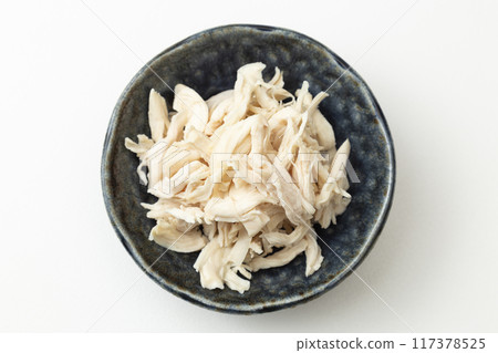 Boiled and split chicken breast on white background Boiled and split chicken breast on white background 117378525