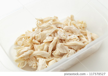 Boiled and split chicken breast on white background Boiled and split chicken breast on white background 117378527