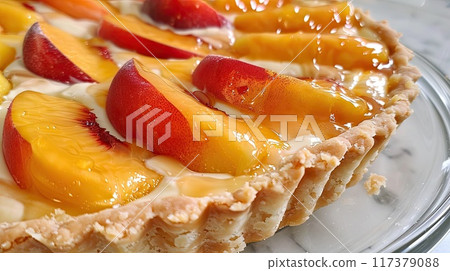 A delectable tart filled with creamy custard, topped with fresh slices of peaches and plums, dusted with powdered sugar, perfect for dessert.. A delectable tart filled with creamy custard, topped with fresh slices of peaches and plums, dusted with powdered sugar, perfect for dessert.. 117379088