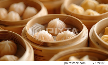 Close-up of assorted steamed dumplings in various vibrant colors, showcasing a delicious array of traditional Asian cuisine.. Close-up of assorted steamed dumplings in various vibrant colors, showcasing a delicious array of traditional Asian cuisine.. 117379485