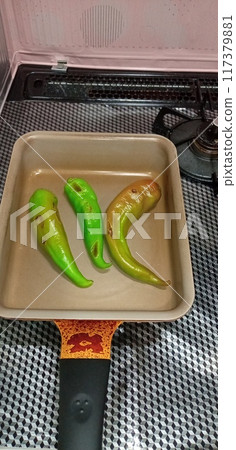 Slightly charred Manganji peppers Slightly charred Manganji peppers 117379881