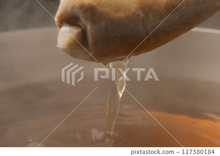 Dashi pack: Lift the dashi pack with chopsticks 117380184