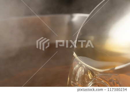 Dashi: Scoop up the dashi with a ladle Dashi: Scoop up the dashi with a ladle 117380234