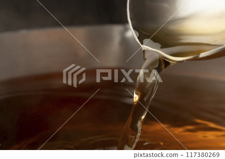 Dashi: Scoop up the dashi with a ladle Dashi: Scoop up the dashi with a ladle 117380269