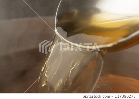 Dashi: Scoop up the dashi with a ladle Dashi: Scoop up the dashi with a ladle 117380275