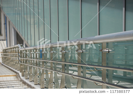 Stairs and barrier-free facilities in a city street during summer daytime 117380377