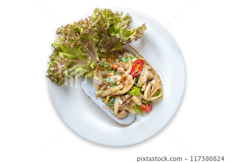 Spicy stir-fried Thai razor clams served on shells on isolate white background. 117380824