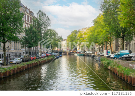 Amsterdam Summer Canal and Parked Boats and Cars Amsterdam Summer Canal and Parked Boats and Cars 117381155