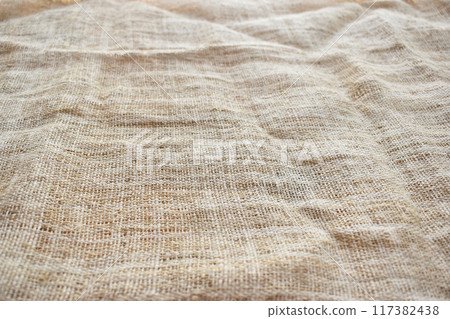 brown sackcloth texture background, crumpled burlap fabric textile for design 117382438