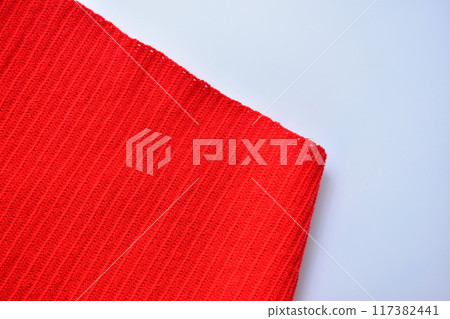 red wool knitted yarn texture, woolen fabric on white background red wool knitted yarn texture, woolen fabric on white background 117382441