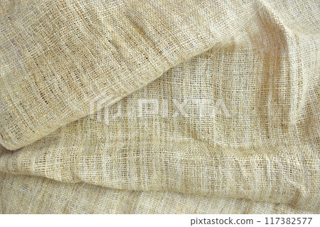 brown sackcloth texture background, crumpled burlap fabric textile for design 117382577