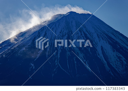 Snow and smoke rising from Mt. Fuji as seen from Onigatake in the Misaka Mountains Snow and smoke rising from Mt. Fuji as seen from Onigatake in the Misaka Mountains 117383343