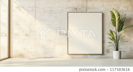 Modern indoor setting with blank frame and potted palm plant against textured wall 117383616