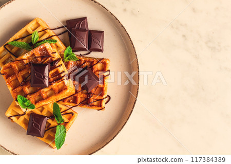 Viennese waffles, with chocolate, breakfast, on a beige background, no people, selective focus, Viennese waffles, with chocolate, breakfast, on a beige background, no people, selective focus, 117384389