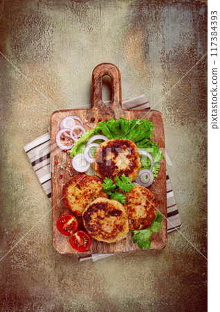 fried chicken cutlets, minced chicken, with vegetables, on a cutting board, with vegetable salad, top view, homemade, no people, 117384393